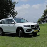 Side view of a premium white SUV Benz GLS 350 ready for a wedding ceremony in Kerala.